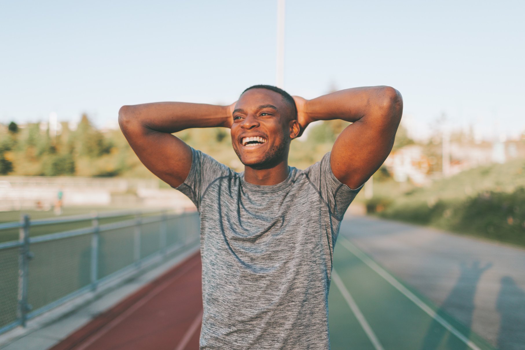 Smiling Man in Sportswear Outdoors