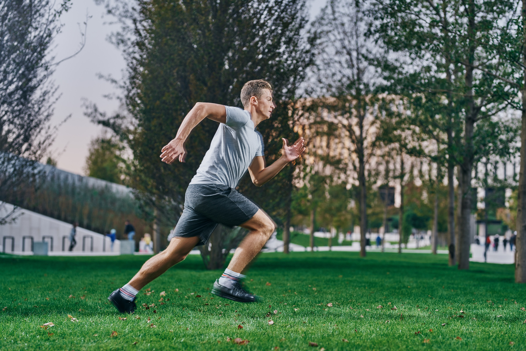 Sports Man Outdoors Jogging Physical Activity Exercise on the Lawn